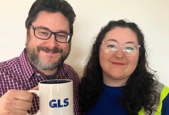 A father and daughter smiling for the camera.