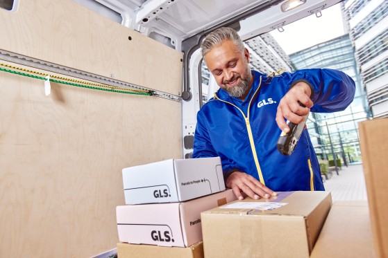 GLS parcel being packed at an e-commerce warehouse